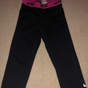 Black nike pro dri fit capris with pink waistband